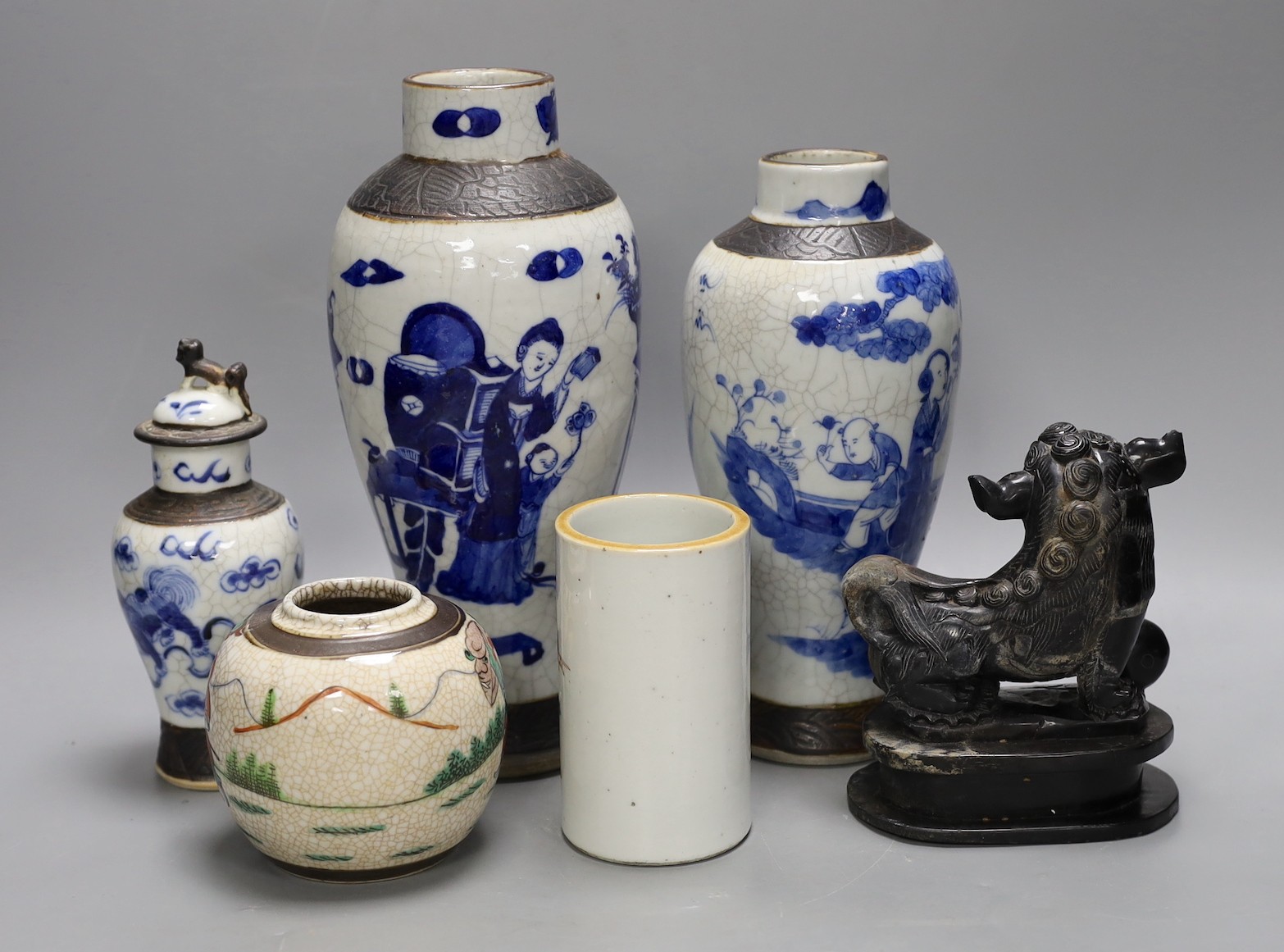 Three Chinese blue and white crackle glaze vases, a famille rose brush pot, late 19th/early 20th century, a crackle glaze ginger jar and a carved soapstone lion-dog (6)